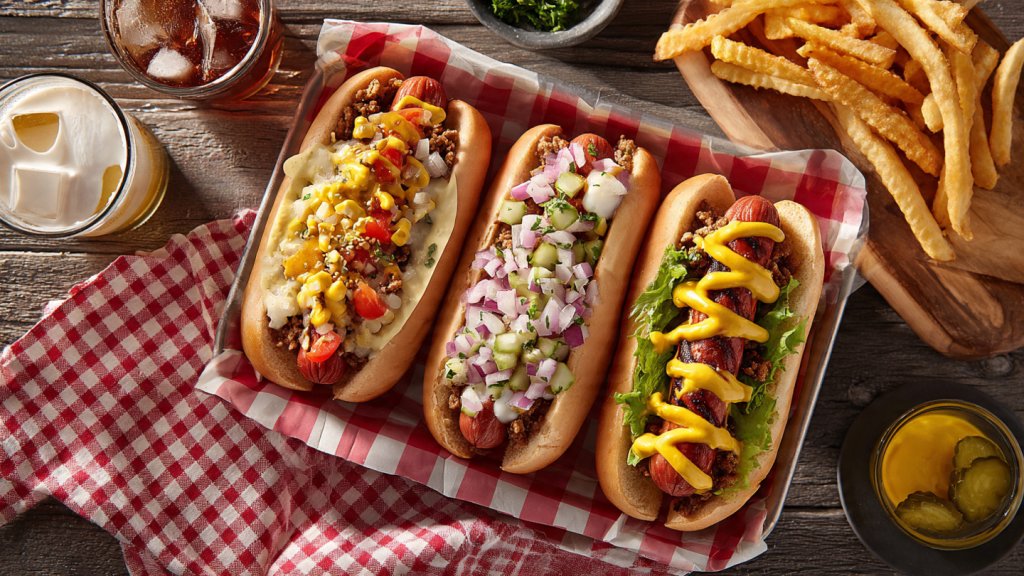 Tray of customizable Cook Out hot dogs with fries and drink.
