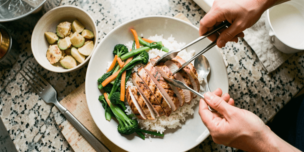 Cookout New Year Meals 2026 meal prep with grilled chicken, rice, veggies, and BBQ leftovers in containers